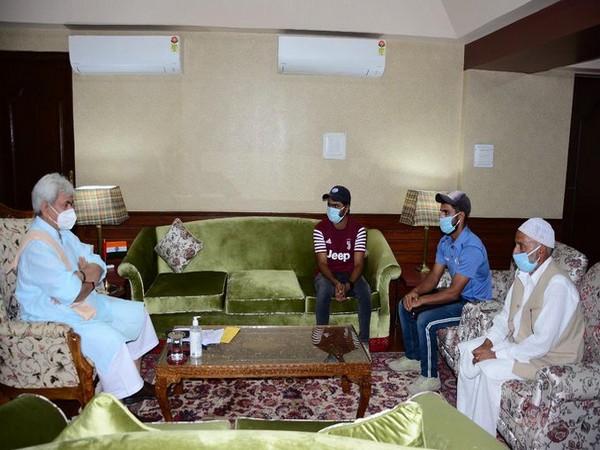 Jammu and Kashmir Lieutenant Governor Manoj Sinha meeting budding cricketer from Kashmir on Monday.