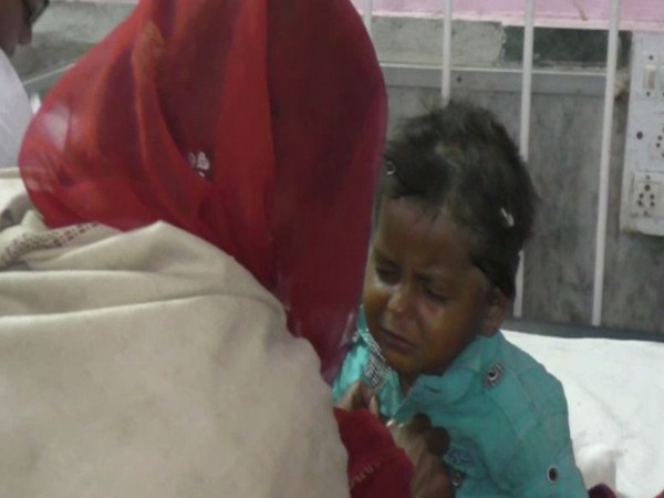 The four year old boy, Bhimaram, with his mother after being rescued from the borewell. Photo/ANI