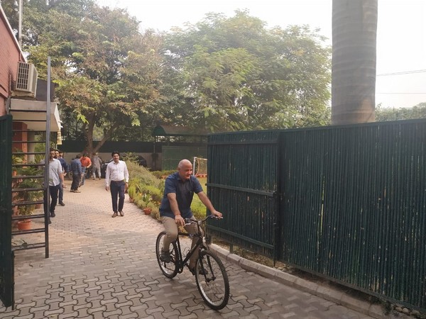 Delhi Deputy Chief Minister Manish Sisodia cycles to work on Monday