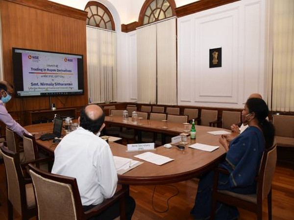 Finance Minister Nirmala Sitaraman (right) launching INR-USD F&O contracts on Friday