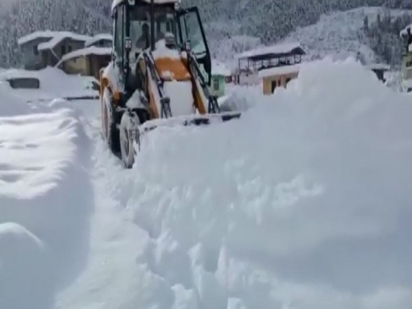 Snow clearing operations at Yamunotri Highway on Saturday.