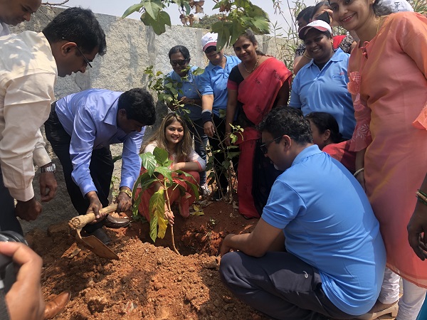 Volunteers planting trees as part of social forestry programme at the village