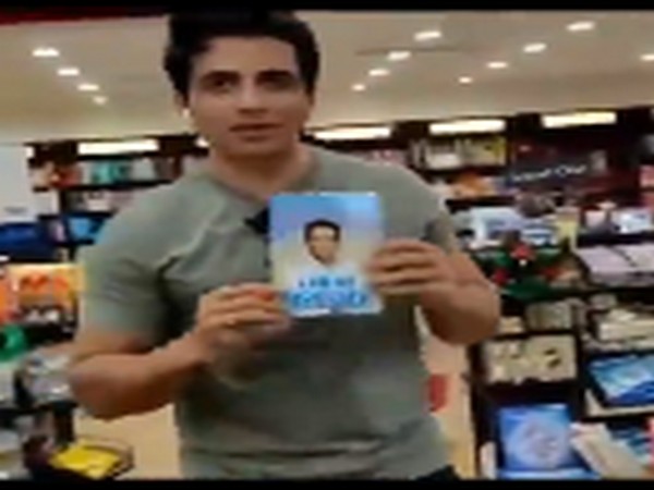 Actor Sonu Sood with his autobiography 'I am No Messiah'. (Image Source: Instagram)
