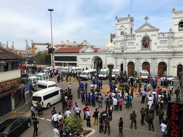 Forces gather outside St. Anthony's Church in Kochchikade after multiple bomb blasts rocked the city on Sundays gather