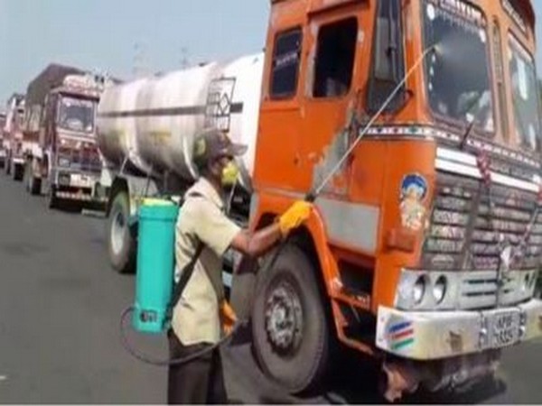 Sodium hypochlorite solution being sprayed on vehicles entering Andhra Pradesh's Srikakulam district