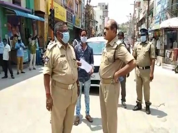 Police officials in red zone areas of Srikalahasti. Photo/ANI