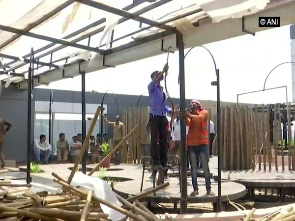 SMC workers tearing down a restaurant in west zone, Surat on Monday. Photo/ANI