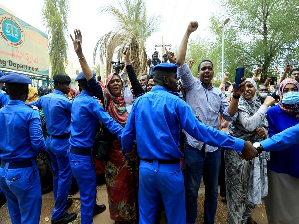 Sudanese police officers controlling civilians. (Photo Credit - Reuters)