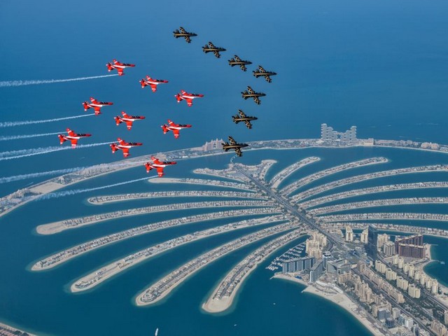 Indian Suryakiran flying with Hawk AJT along with UAE's Al Fursan Air Display Team with Aermacchi MB-339 aircraft at  Dubai's Air Show 2021