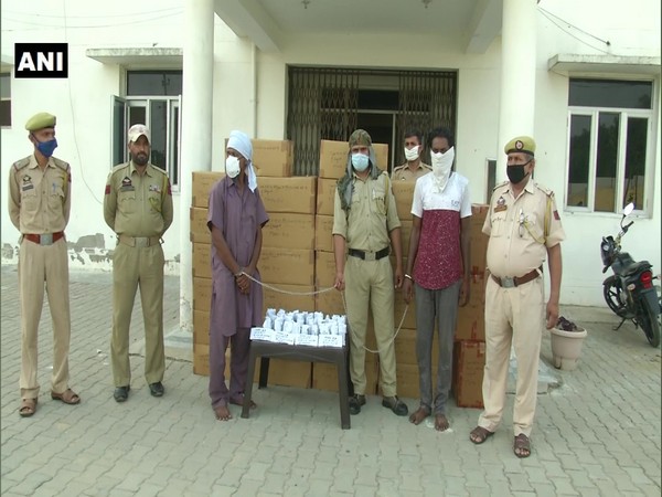 Police line up with the suspects and the busted drugs in Samba, Jammu and Kashmir.