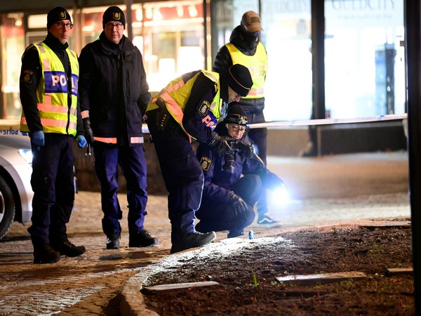 Police forensics team members conducting an investigation at the knife attack site. (Photo credit: Reuters)