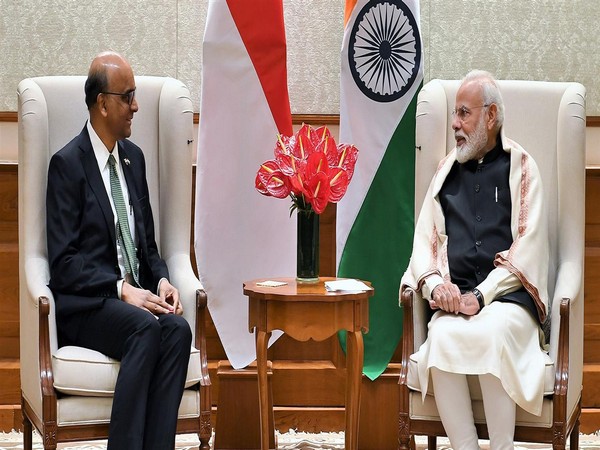 Prime Minister Narendra Modi with Singapore Minister for Social Policies Tharman Shanmugaratnam in New Delhi on Monday