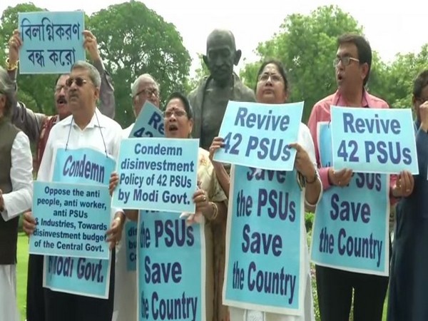 MPs from Trinamool Congress holding protest in front of Gandhi statue in Parliament over disinvestment in Public sector undertakings. (Photo/ANI)