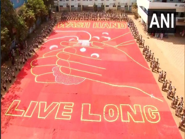 Students of Everwin Vidhyashram school in Kolathur created a mosaic of 'wash hands, live long' to create awareness over COVID-19 on Saturday. Photo/ANI