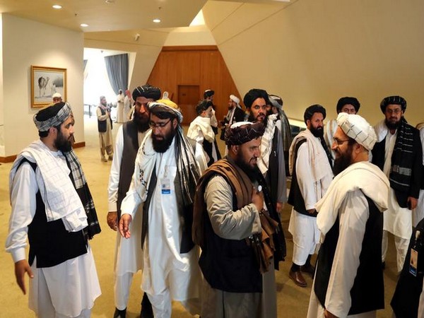 Members of the Taliban delegation gather in Doha ahead of the peace talks in February 