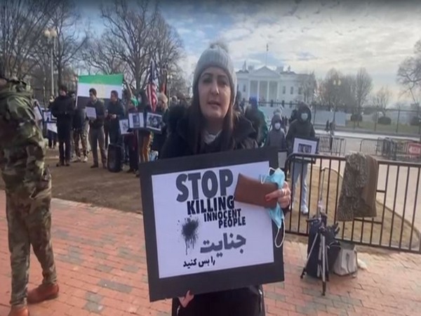 Afghan women's rights activist Khalida Nawabi protesting in front of the White House 