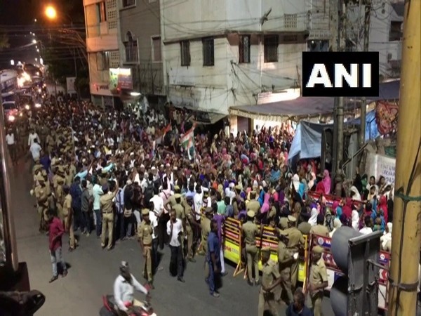 People protesting against the violence in Delhi on Wed