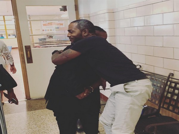 Vohn Lewis hugging his student (Image Courtesy: Facebook- Bradley Cook Kopelove)