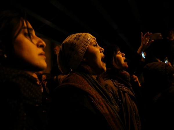 Protestors shout slogans as they gather to show sympathy to the victims of the crash of Boeing 737-800 plane