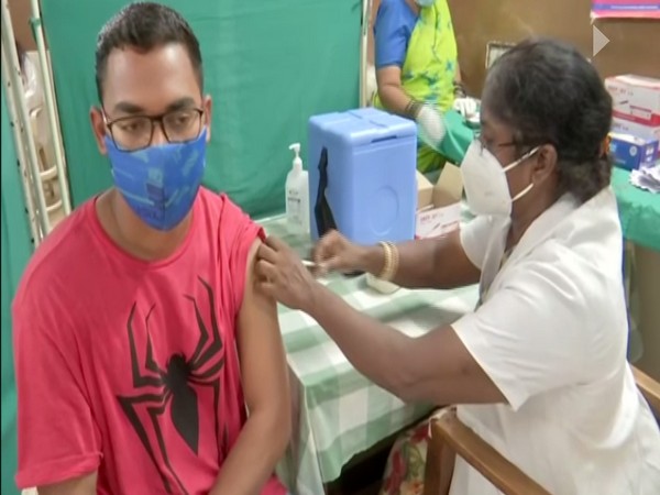 A student, who wants to go to abraod for studies, getting vaccinated himself through special vaccination drive. (Photo/ ANI)