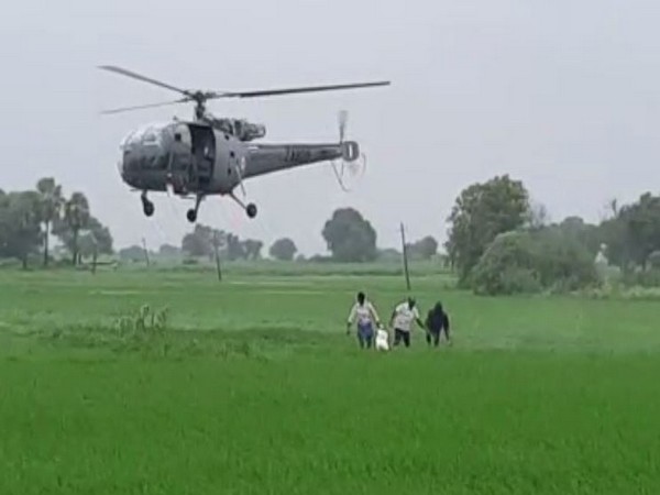 12 farmers trapped inn a stream were rescued by Army helicopter in Telangana on Saturday. Photo/ANI