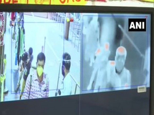 A newly developed artificial intelligence-based screening system that detects people who have a high temperature or those not wearing masks. Photo/ANI