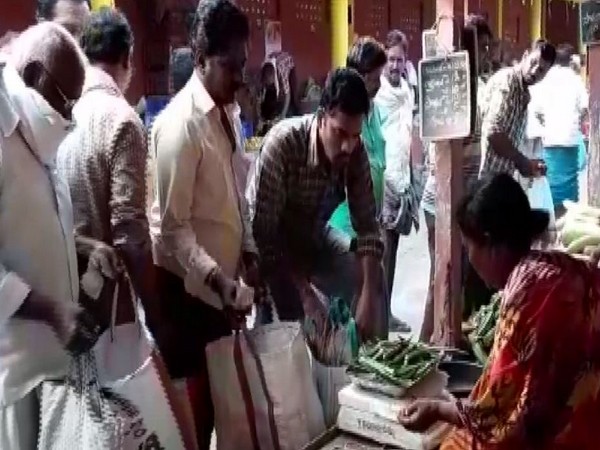 People were seen rushing to vegetable market at Madannapet here as the Telangana government announced a lockdown in the state in a bid to combat the spread of the coronavirus. Photo/ANI
