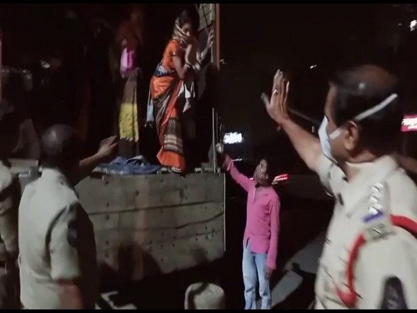 Migrant workers deboarding the goods lorry in Hyderabad, Telangana. (Photo/ANI)