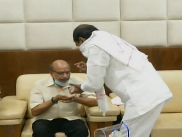 Telangana CM presenting Kaloji Award to poet Rama Chandramouli on Wednesday. Photo/ANI 