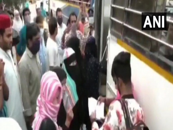 218 stranded people in Nellore being boarded in buses. Photo/ANI