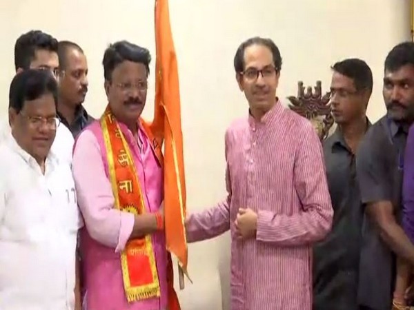 Former Congress MLA Dileep Mane with Shiv Sena president Uddhav Thackeray after joining the party in Mumbai on Wednesday. (Photo/ANI)