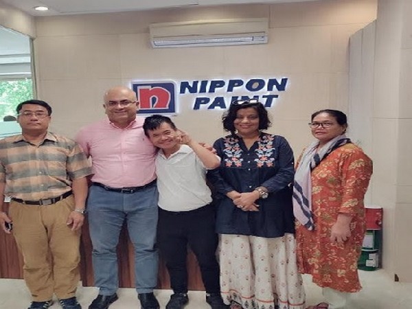 Thamjit Mayengbam and his family with Sharad Malhotra and Manjir Gupta