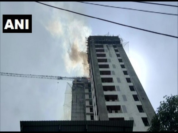 An under-construction building under fire in Thane on Friday.