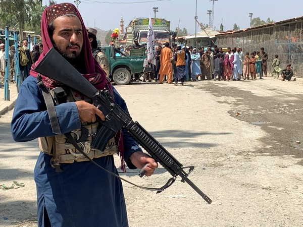A member of the Taliban forces stands guard at the Pakistan-Afghanistan crossing border, in Torkham, Pakistan. (Image credit: Reuters)