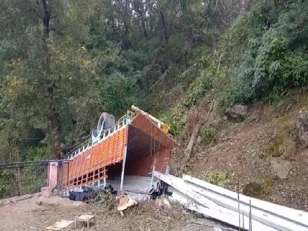 A truck overturned and fell on the roof of a house in Bilaspur. (Photo ANI)