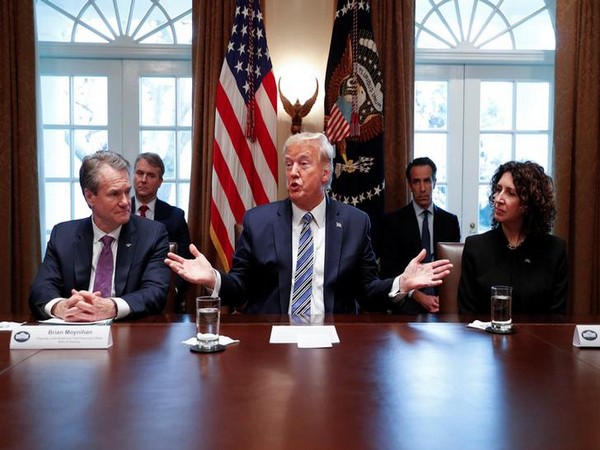 US President Donald Trump delivers remarks to the news media during a meeting with bankers on coronavirus response