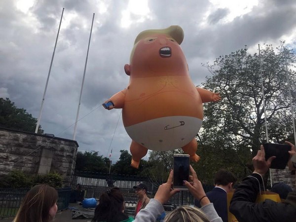 A blimp depicting US President Donald Trump at display in Dublin on Thursday.