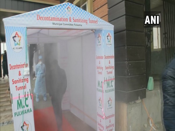 A disinfection tunnel has been installed at the entry of the isolation facility in Pulwama. Photo/ANI