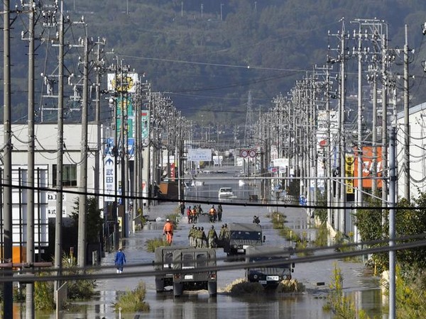 A residential area flooded by the Chikuma river, caused by typhoon Hagibis is seen in Nagano, central Japan on Sunday. (Photo/Reuters)