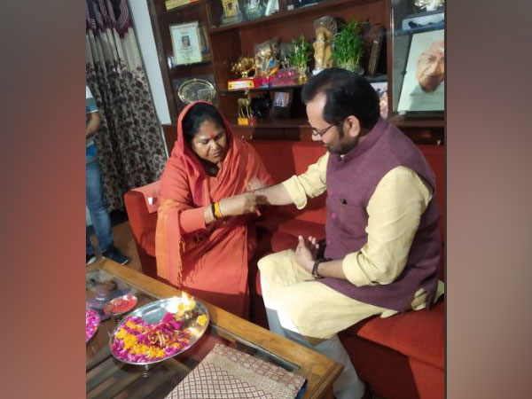Union Minister Sadhvi Niranjan Jyoti ties rakhi to Union Minister Mukhtar Abbas Naqvi here on Thursday(Photo/ANI)