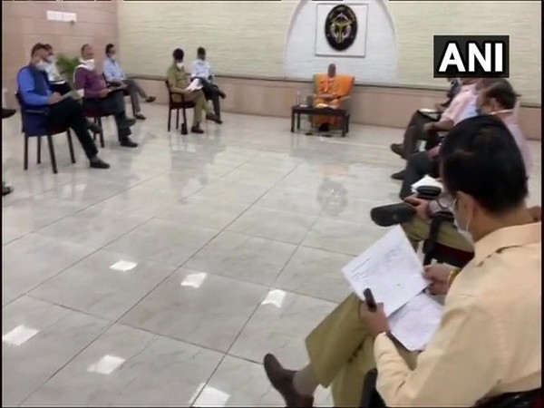 CM Yogi Adityanath chairs a meeting at his official residence (photo/ANI)
