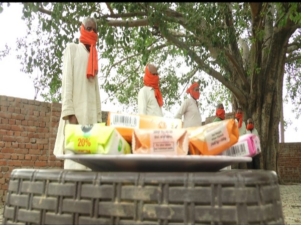 BJP Yuva Morcha distributes Gamchas and soaps in Aligarh. (Photo/ANI) 