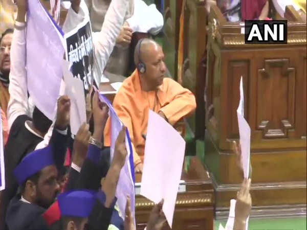 Uttar Pradesh Chief Minister watches as Opposition MLAs protest in the assembly over different issues on Thursday. Photo/ANI 