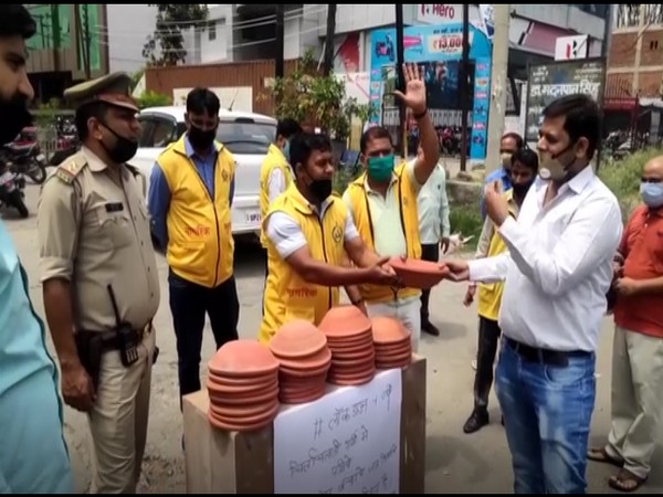Civil Defence distributes earthen pots, asks people to provide water to birds amid high temperatures in Moradabad. (Photo/ANI)