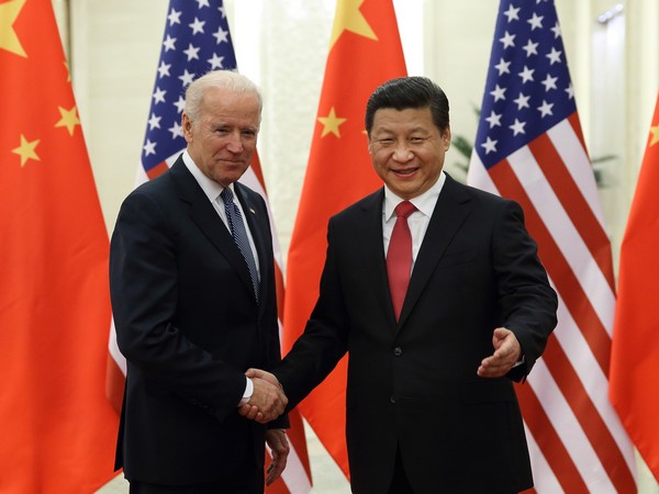 On December 4, 2013, Chinese President Xi Jinping shakes hands with then Vice President Joe Biden (Image Credit: Photo=Xinhua/NEWSIS) 