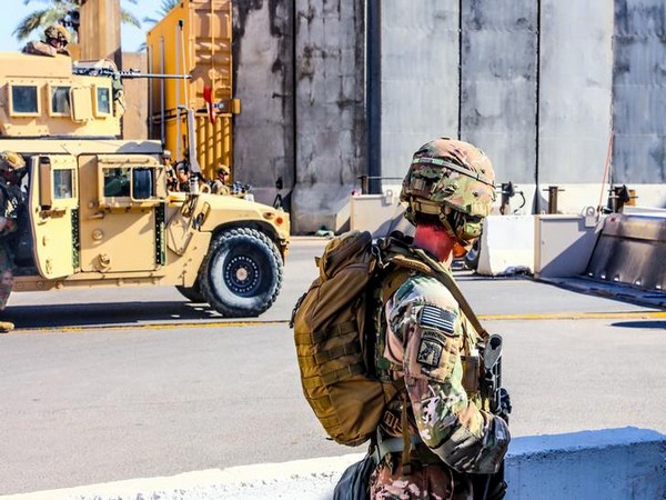 US Army soldiers from 1st Brigade, 25th Infantry Division, Task Force-Iraq, man a defensive position at Forward Operating Base Union III in Baghdad, Iraq.