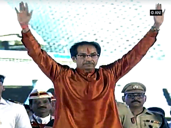 Chief Minister Uddhav Thackeray waiving at the crowd after taking oath here in Mumbai on Thursday. Photo/ANI