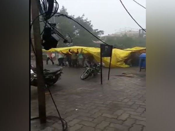 People enjoy 'baraat' under tarpaulin cover amid heavy rainfall