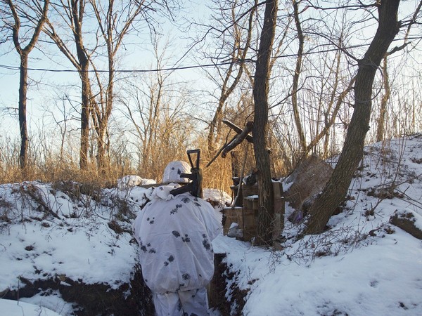 A service member of the Ukrainian armed forces stands guard. (Photo Credit - Reuters)
