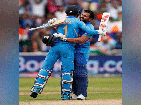 India's Rohit Sharma celebrates his century against Bangladesh with KL Rahul
